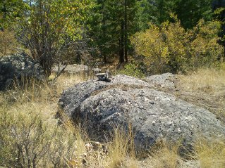 Rock pile marker shows where trail drops into the narrow ravine on east side of peak, Oliver Mtn 2011-09.